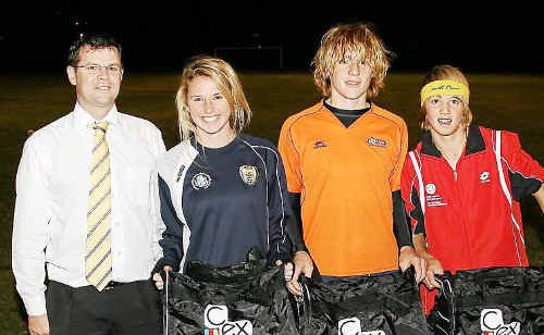 Operations manager for C.ex Jeff Cox presents State Youth League players Jasmin Courtenay, Noah Bedford and Harry Atherton with their free kits last week. Operations manager for C.ex Jeff Cox presents State Youth League players Jasmin Courtenay, Noah Bedford and Harry Atherton with their free kits last week.